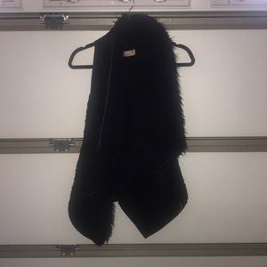 Black “fur” vest